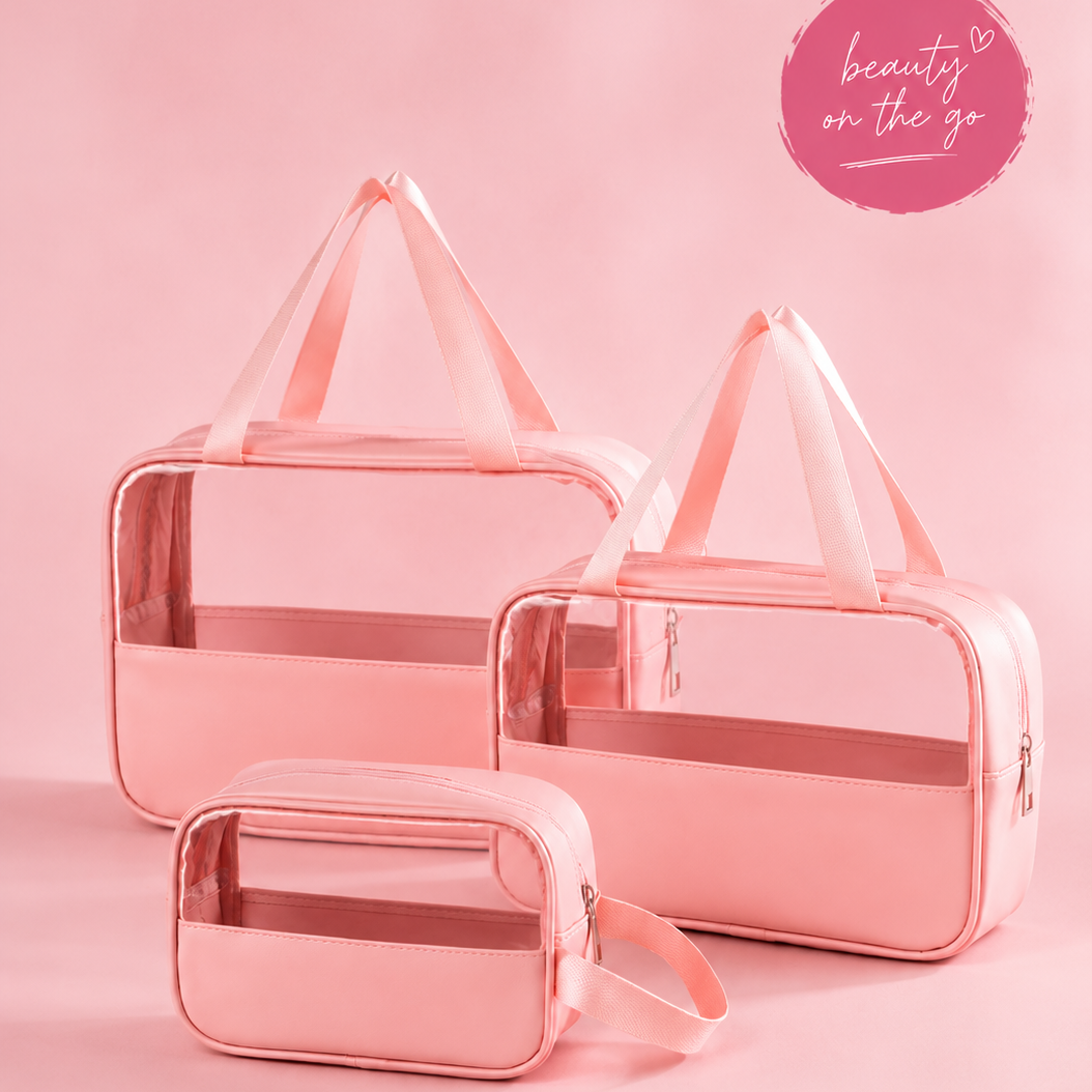 Set of three pink transparent cosmetic bags on a pink background with 'beauty on the go' text.