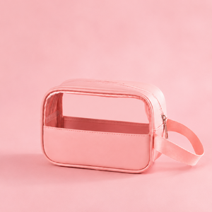 Pink transparent cosmetic bag on a pink background
