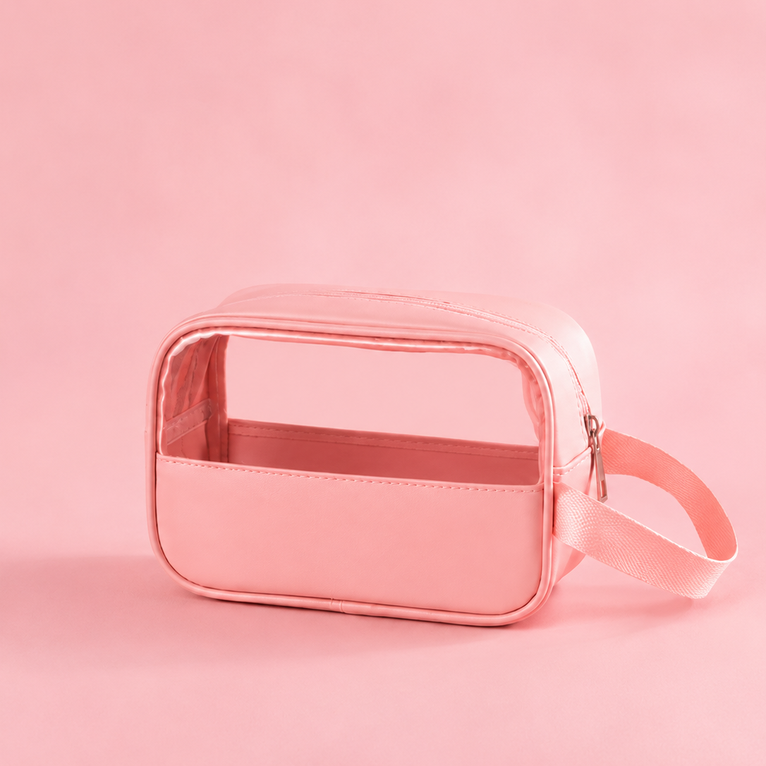 Pink transparent cosmetic bag on a pink background